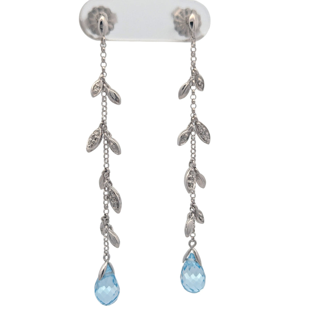 14K white gold, diamond, and blue topaz earrings.