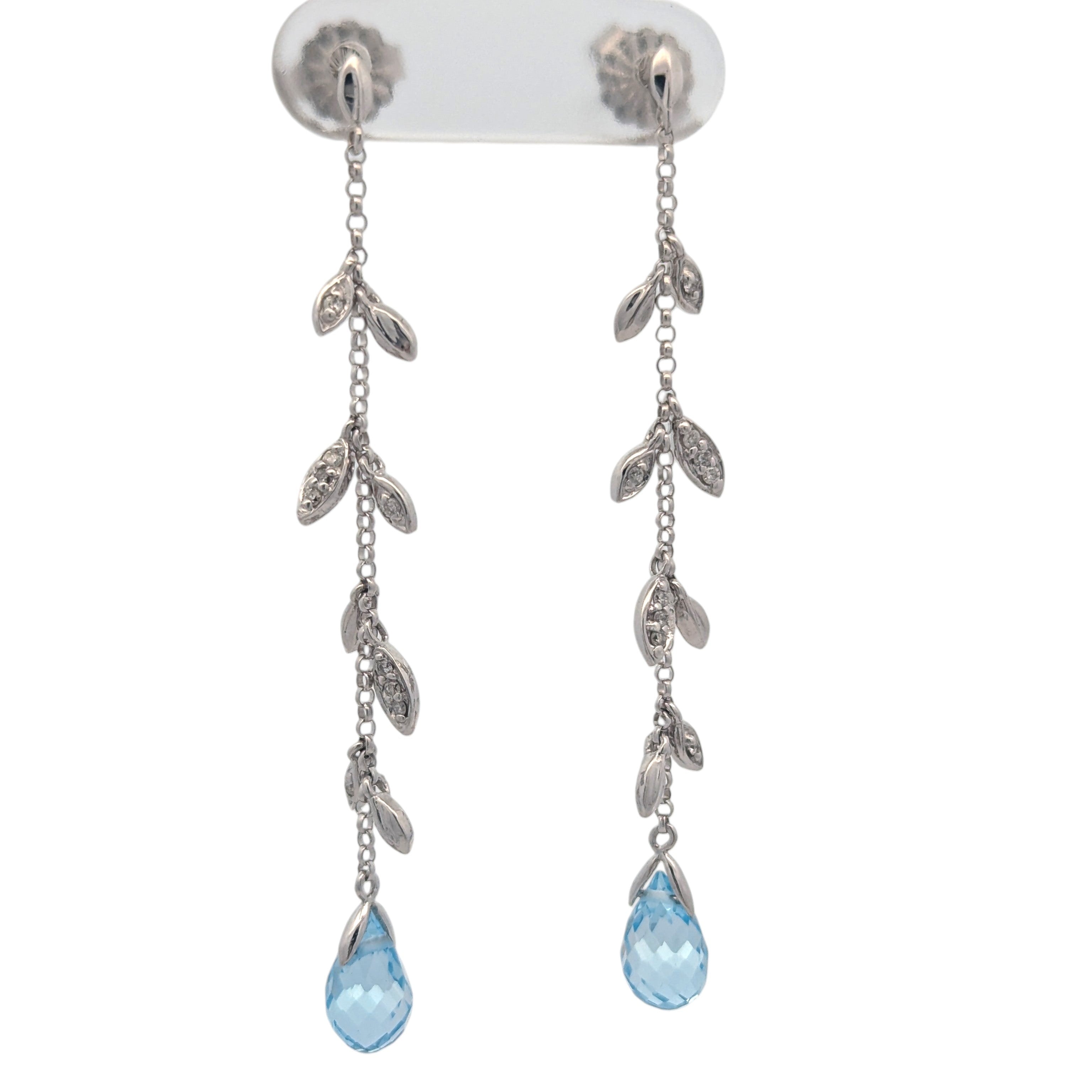 14K white gold, diamond, and blue topaz earrings.