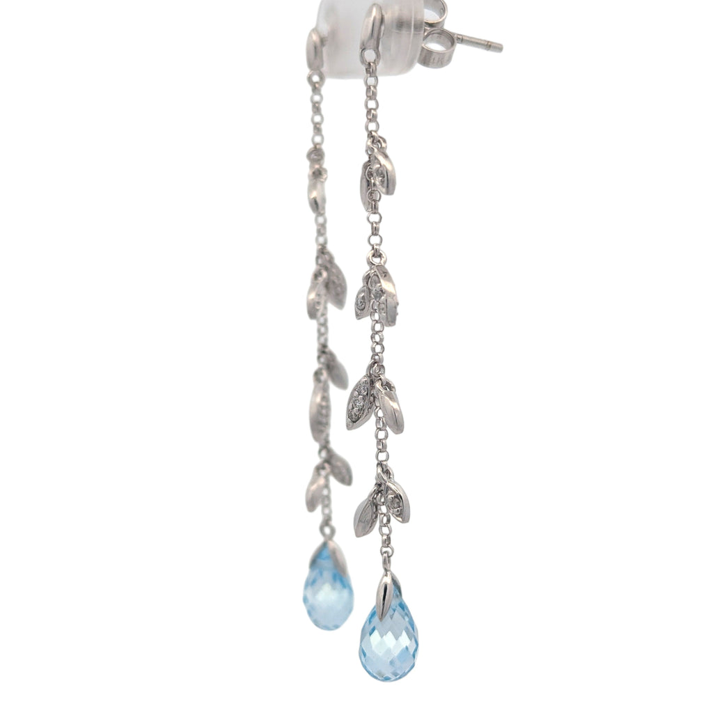 14K white gold, diamond, and blue topaz earrings.