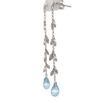 14K white gold, diamond, and blue topaz earrings.
